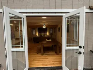 French doors open to deck/dining area.