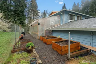 Those with a green thumb will greatly appreciate this tranquil garden space and large, organized greenhouse.
