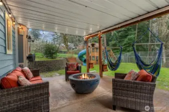With access from the bottom floor and top deck, this covered patio space is perfect for evening gatherings and social company.