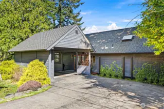 Attached one car carport with ample utility and attic storage