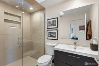 Primary bathroom with glass-enclosed shower
