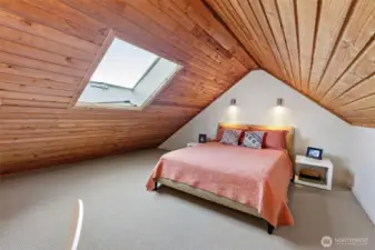 Skylight provides lofted bedroom with ventilation and plenty of natural light