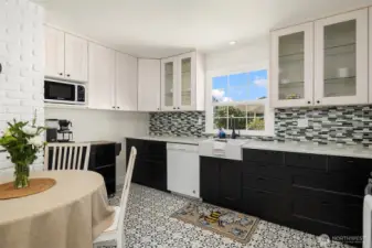 Remodeled kitchen with eating area. New cabinets w/ quartz counters and new flooring.