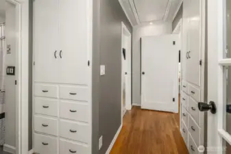 Hallway to bedrooms with lots of built in storage