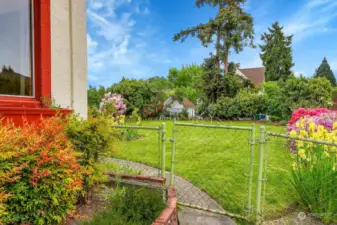 Fully fenced yard and gardens