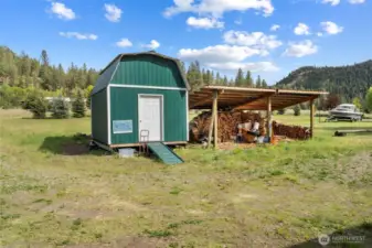 Large storage shed attached to woodshed