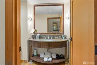 Vanity in bathroom with all the supplies.