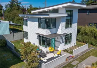 This clean, contemporary home in the middle of downtown Eastsound is being sold with an active vacation rental permit. It is an excellent investment property or simply convenient village living.