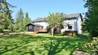 Rear of the home and huge backyard.