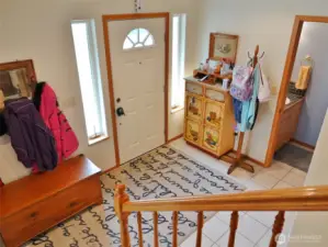 Entry w/ a 1/2-bathroom off to the right.