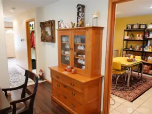 Dining Room leading into the downstairs Bedroom, and then down the hall to the Mud/Laundry Room and Entry.