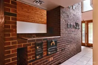 Masonary heating system, living room and bedrooms are wired for baseboard 200 amp