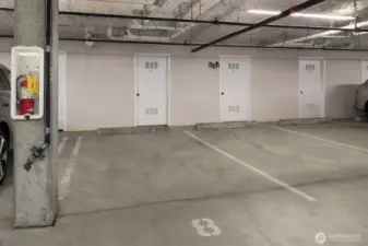 One of two dedicated parking spaces.  The large, dedicated storage room is just beyond the parking spot.