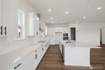 This home has a different color cabinet that is called Artic Grey stain - with a color palate of light grey flooring a grey tile. NOT ACTUAL HOME but represents the layout.