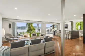 Great room designed for effortless entertaining and everyday luxury. Floor to ceiling Nana doors open completely to the covered deck, blending indoor comfort with the beauty of Lake Sammamish.