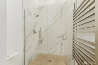 Beautiful primary shower with heated towel bar