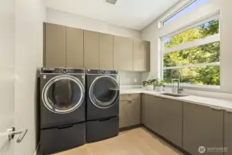 Spacious laundry room with ample stoarge