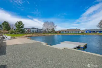 Looking toward the adjacent pathway leading to the Community rec area  just a 1 minute stroll away to tennis, pickleball, golf, heated pool & more!