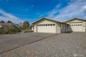 Large attached Double Garage & adjoining RV style tall RV style garage or bonus living space which is currently utilized for media and Rec room etc.