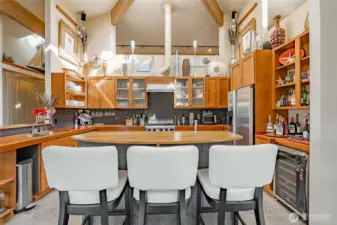 Stainless Appliances compliment the rich woods. Loads of creative storage!