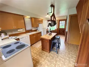 Kitchen island and door to the covered back patio.