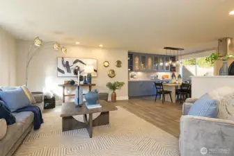 Living room opens to the dining room and views out to front and back yards