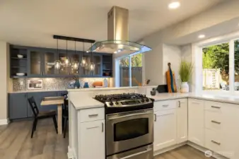 Kitchen opens to living and dining spaces.