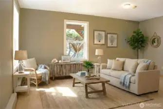 The lower-level living room offers a bright, inviting space with neutral tones and large windows for natural light.