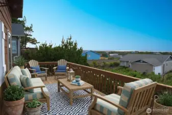 The upstairs deck offers a spacious outdoor retreat for comfortable seating and sweeping ocean views.