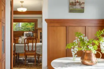 View from the dining to the kitchen eating nook. Detail of the wainscoting which was added to blend with the original woodwork at the time of the kitchen restoration.