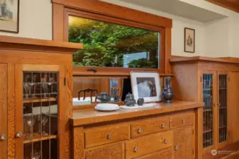 The perfect built-ins for china, glass, silverware and tablecloths are original to the home with its crystal knobs and beautiful leaded glass doors.