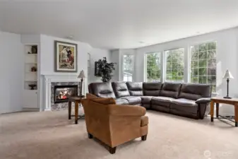 Family rooms with built-ins surrounding the gas fireplace.