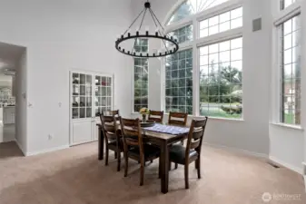 Light streams into the lovely formal dining room with soaring ceilings & built in china hutch!