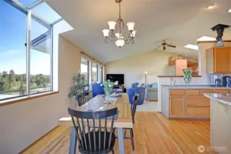 Natural oak hardwood floors in kitchen and dining area...