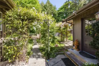 Approaching the front door on the left and door to the garage on the right.
