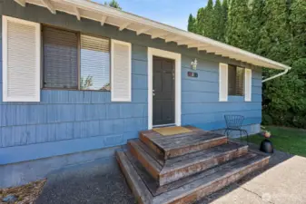 This cute shuttered home exudes charm and curb appeal with its classic exterior and entry.