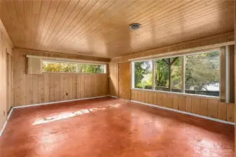 Spacious lower-level rec room featuring water views and a private separate entrance, offering flexibility for guests or extended living.