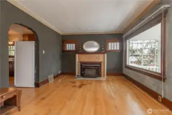Enter nto this tme capsule of original charm with this stunning fireplace and moulded archway.