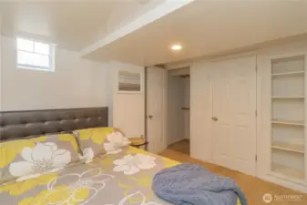 This bedroom has additional built in shelving.