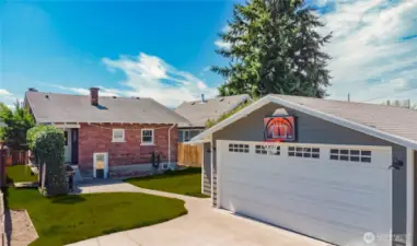 Your backyard retreat in the heart of the city offers versatility that no other property can offer. (Grass is photo enhanced to green)