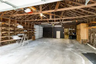 Roll-up door on the side offers access to the back field. Man door leads to the shop.