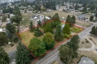 Vacant parcel is 0.60 acre. The parcel with the home is 1.25 acres. Approximate property lines are shown.