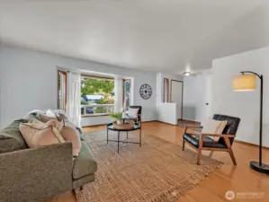 View of bay window shaded by maple tree