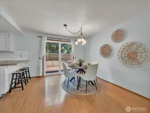 Follow the living room over to the dining room that faces the kitchen and is complete with slider to deck and patio area