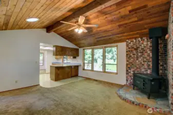 View of the family room with wood stove and kitchen