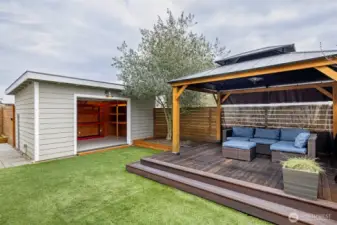 Deck, turf and shed in back yard