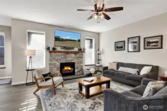 A newly installed gas fireplace serves as the heart of the room, adding warmth and style while grounding the space for everyday living and entertaining alike.