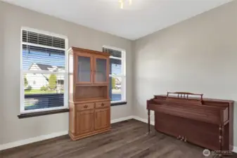 The 4th bedroom is located in the hallway with the primary suite.