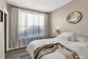 Bedroom 3 overlooks the back yard & includes a walk in closet.