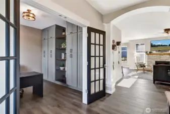 So many architectural features enhance this home, note the built ins in the den.